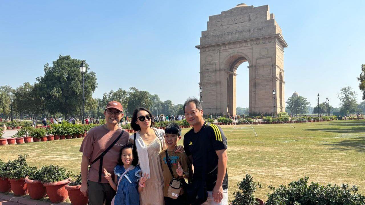 Tourists posing in front of India Gate in Delhi during the first day of the Golden Triangle Tour.